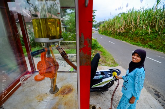 Most women in Sumatra wear pyjamas for clothes. It's quite bizarre. This is someone's front yard mini-petrol station. Quite professional when compared with the racks of glass bottles in most of Indonesia.