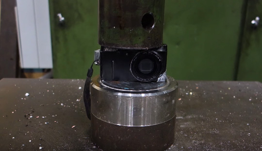 Nikon-Coolpix-P300-camera-getting-crushed-by-a-hydraulic-press