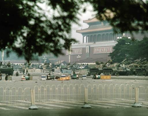 Tanks and soldiers surround the perimeter of Tiananmen Square, June 4, 1989. Photo by Terril Jones/AP.