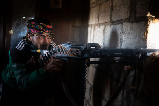Syrian civil war: A Kurdish-Arab fighter fires his machinegun on Turkish backed militants in late 2019 / Z6, 50mm, f2.8, ISO 2000