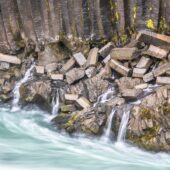 A series of small falls flow out from under the basalt columns. Nikon D810, 70–200mm at 140mm, ISO 100, 1s at f/4.5, tripod, BP X4 6-stop CPL